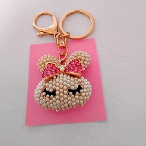 Bag Charm In Pearl With Pink Bow.